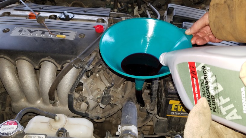 Automatic transmisison fluid being added to a Honda Accord