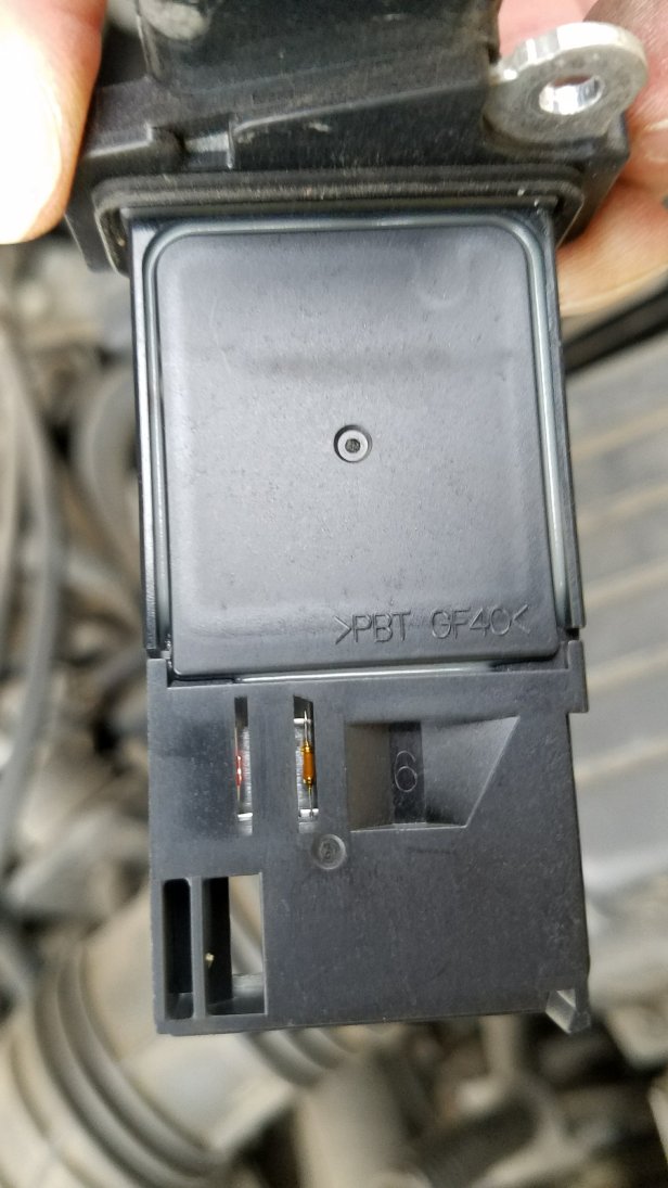 Close up view of a honda accord mass airflow sensor removed