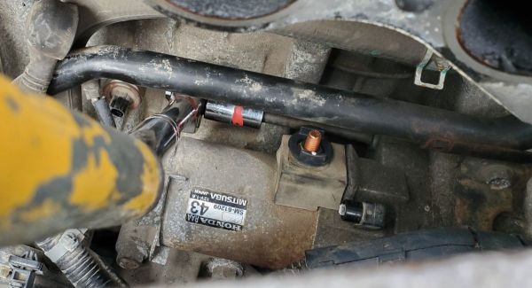 Remove the 14mm Upper Mounting bolt starter Honda Accord