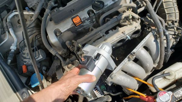Install the new starter into a Honda Accord